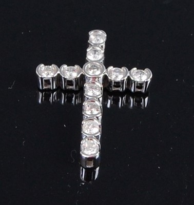 Lot 347 - A 14ct white gold diamond set cross pendant,...