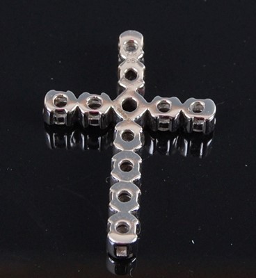 Lot 2072 - A 14ct white gold diamond set cross pendant,...