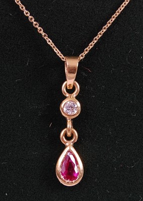 Lot 2077 - An 18ct yellow gold, ruby and diamond pendant,...