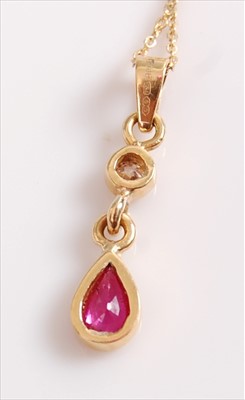 Lot 2077 - An 18ct yellow gold, ruby and diamond pendant,...