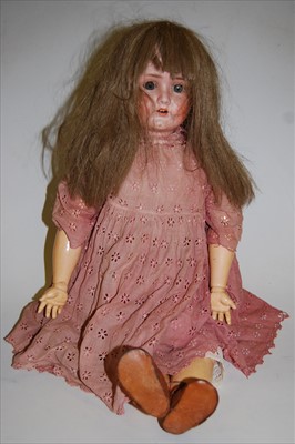 Lot 2135 - A Schoenau & Hoffmeister bisque head doll,...