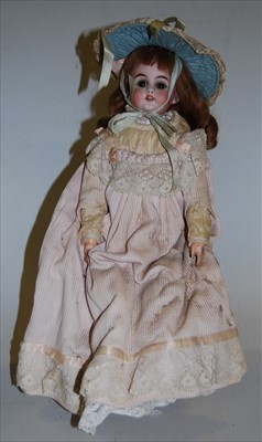 Lot 2145 - An unmarked bisque head doll, having rolling...