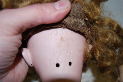 Lot 2146 - A Simon & Halbig bisque head doll, having...