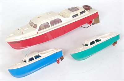 Lot 558 - Three plastic cabin cruiser clockwork boards:-...