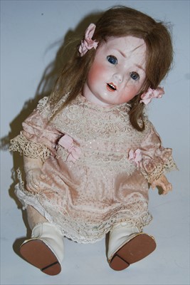 Lot 2160 - A Schoenau & Hoffmeister bisque head doll,...