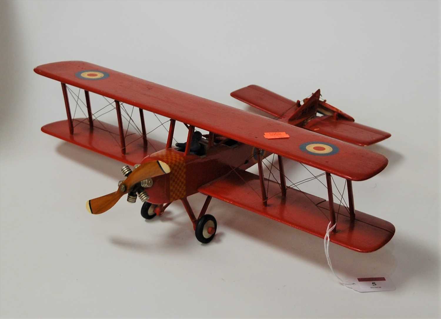 Lot 5 - A painted softwood model of a biplane, with...
