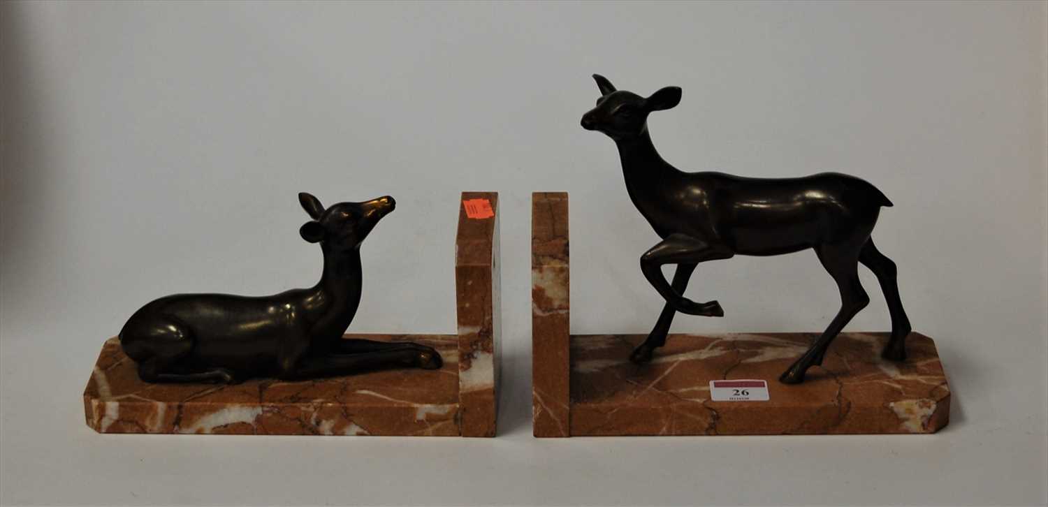 Lot 26 - A pair of Art Deco book-ends, each modelled as...