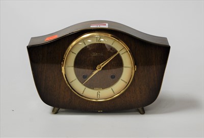 Lot 31 - A 1950s Hermle walnut cased mantel clock