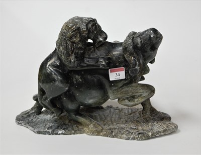 Lot 34 - A Chinese soapstone carving of a water buffalo...