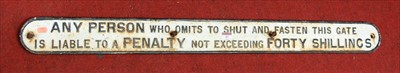 Lot 37 - A cast iron railway notice sign 'Any person...