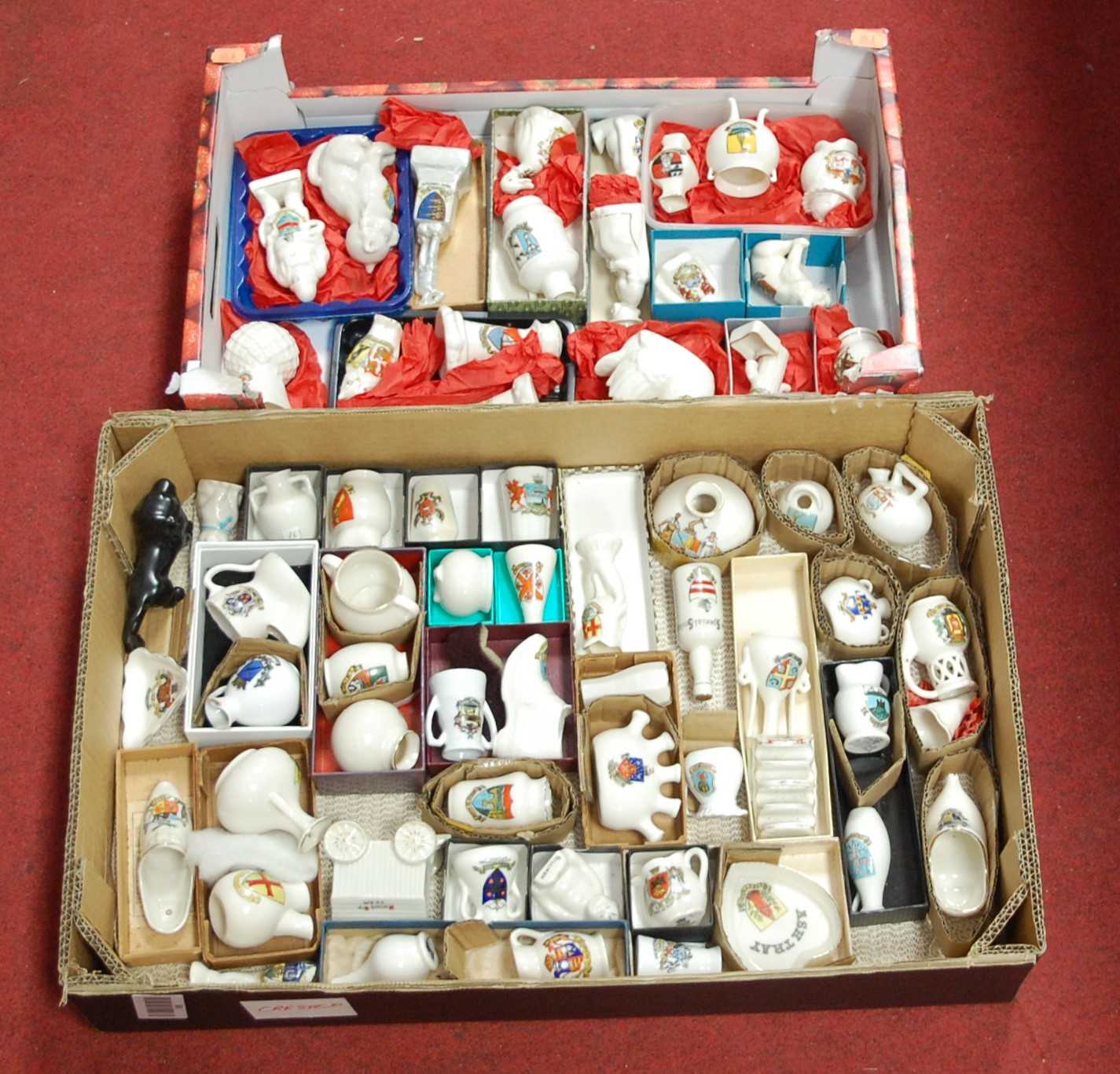 Lot 69 - A collection of crested cabinet china wares,...