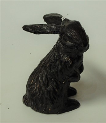 Lot 106 - A bronzed earthenware model of a recumbent hare
