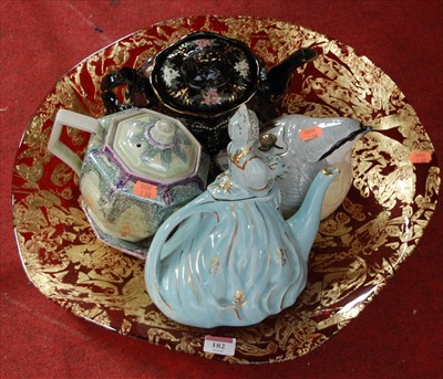 Lot 182 - Four novelty teapots to include lustre glazed...