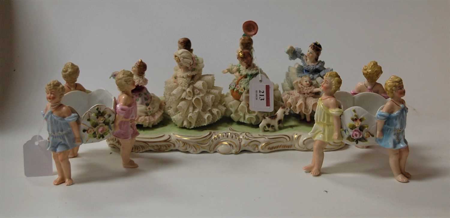 Lot 213 - An 'Irish Dresden' crinoline porcelain group,...