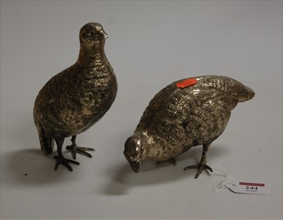 Lot 244 - A pair of silver plated models of game-birds,...