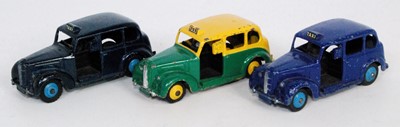 Lot 1955 - Three various loose Dinky Toy taxis to include...