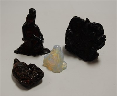 Lot 274 - A polished resin figure of Guanyin(?), in...