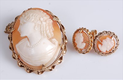 Lot 388 - A carved shell cameo brooch depicting profile...