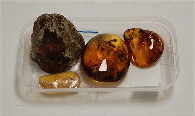 Lot 310 - A large amber coloured resin boulder, with...