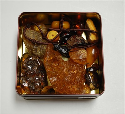 Lot 318 - A teardrop shaped amber(?) bead, 4cm; together...