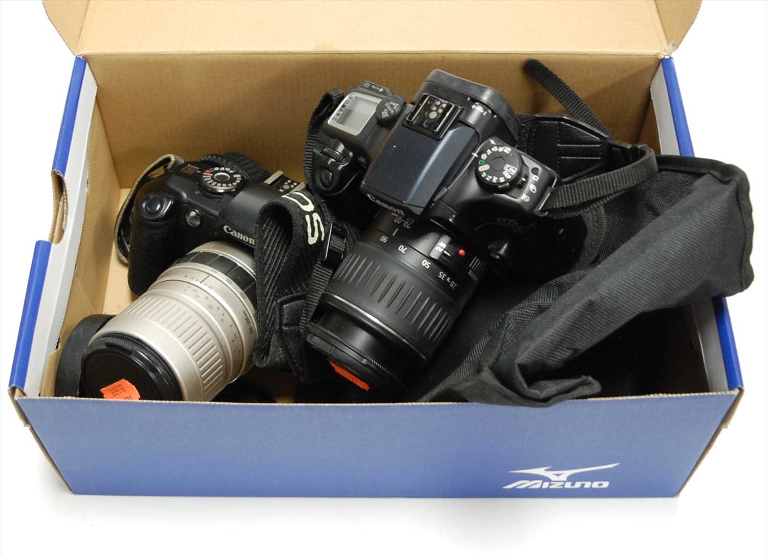Lot 489 - A Canon EOS 33 digital camera together with a...