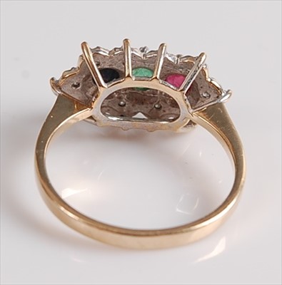 Lot 2133 - A 9ct yellow and white gold, ruby, emerald,...