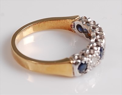 Lot 2141 - An 18ct yellow and white gold, sapphire and...