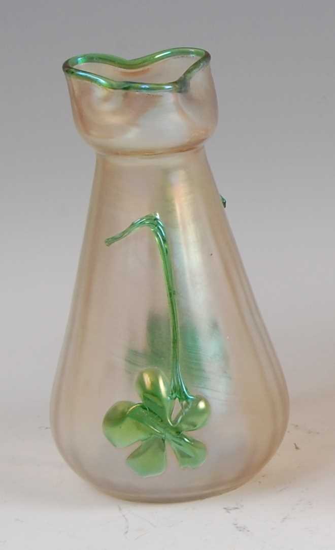 Lot 69 - An Art Nouveau Loetz type vaseline glass vase,...