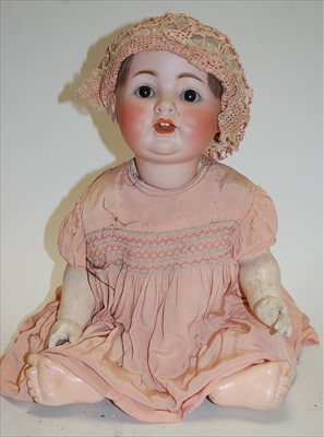 Lot 2179 - A German Character Toddler bisque head doll,...