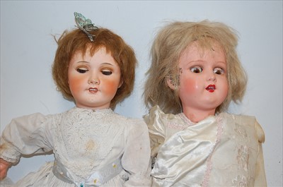 Lot 2180 - A French bisque head doll, having rolling blue...