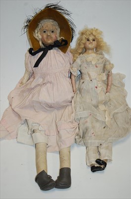 Lot 2182 - A German wax on composition doll, having brown...