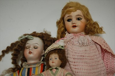 Lot 2199 - A German bisque head doll, having rolling blue...