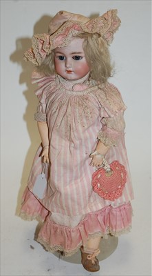 Lot 2208 - A Schmidt & Co bisque head doll, having...