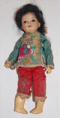 Lot 2211 - An unmarked bisque head Oriental doll,...