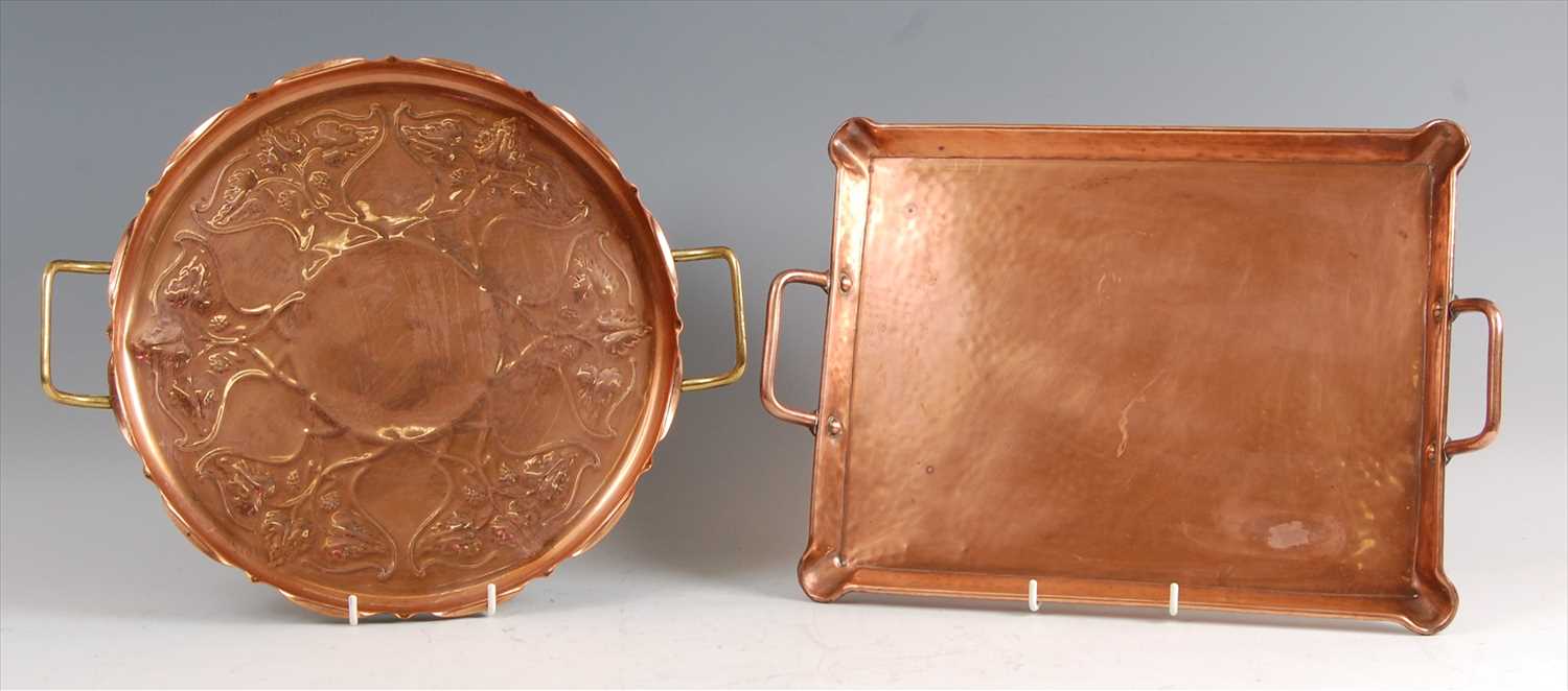 Lot 175 - An Arts & Crafts copper and brass twin handled...