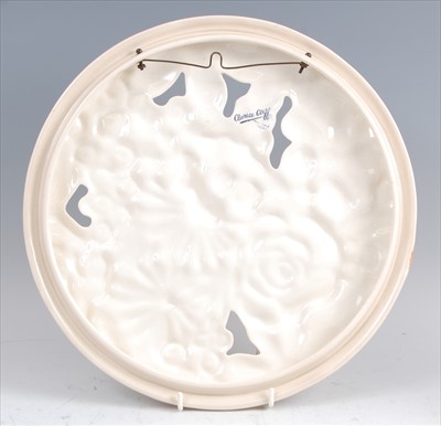 Lot 37 - A 1930s Clarice Cliff pottery circular wall...