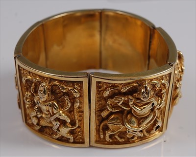 Lot 1213 - A yellow metal Asian style panel bangle,...