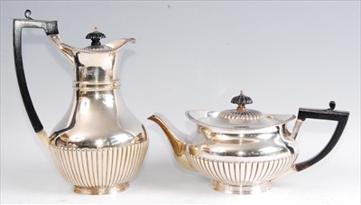 Lot 1140 - A late Victorian silver teapot with matching...