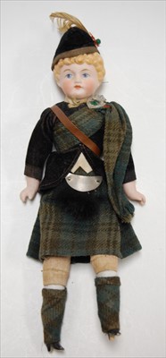 Lot 2254 - A bisque head doll, having moulded light brown...