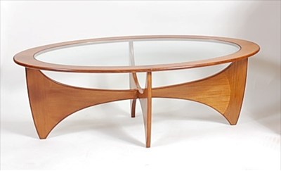 Lot 399 - A 1960s G-Plan teak and smoky glass inset...