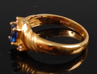 Lot 2158 - An 18ct yellow gold, sapphire and diamond...