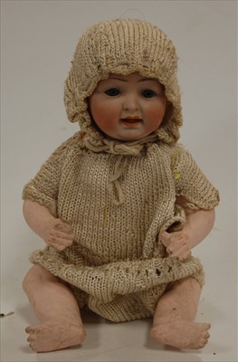 Lot 2287 - An unmarked bisque head doll, having rolling...