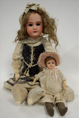 Lot 2289 - A German bisque head doll, having rolling...