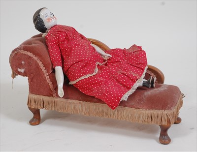 Lot 2305 - A German porcelain head High - brow doll,...