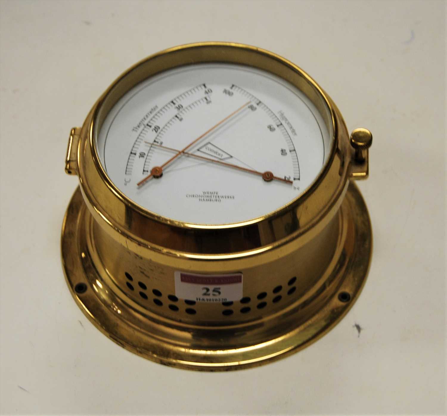 Lot 25 - A modern German brass cased thermometer /...