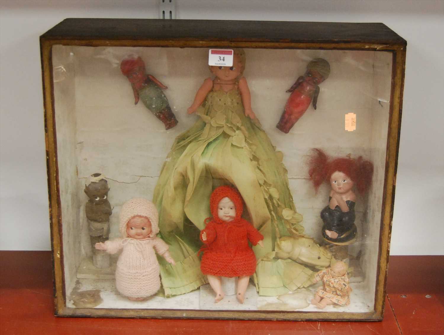 Lot 34 - A collection of plastic and other dolls...
