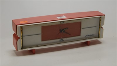 Lot 48 - A 1960s Seiko Robin alarm clock, in pink and...