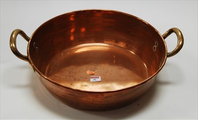Lot 96 - An early 20th century copper twin handled...