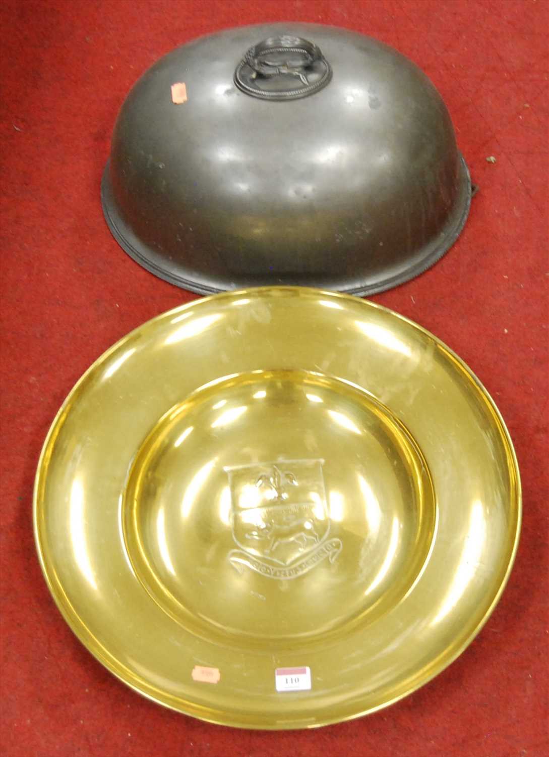 Lot 110 - A large brass charger, the convex centre...