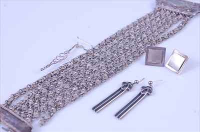 Lot 326 - A white metal and filigree worked multi strand...